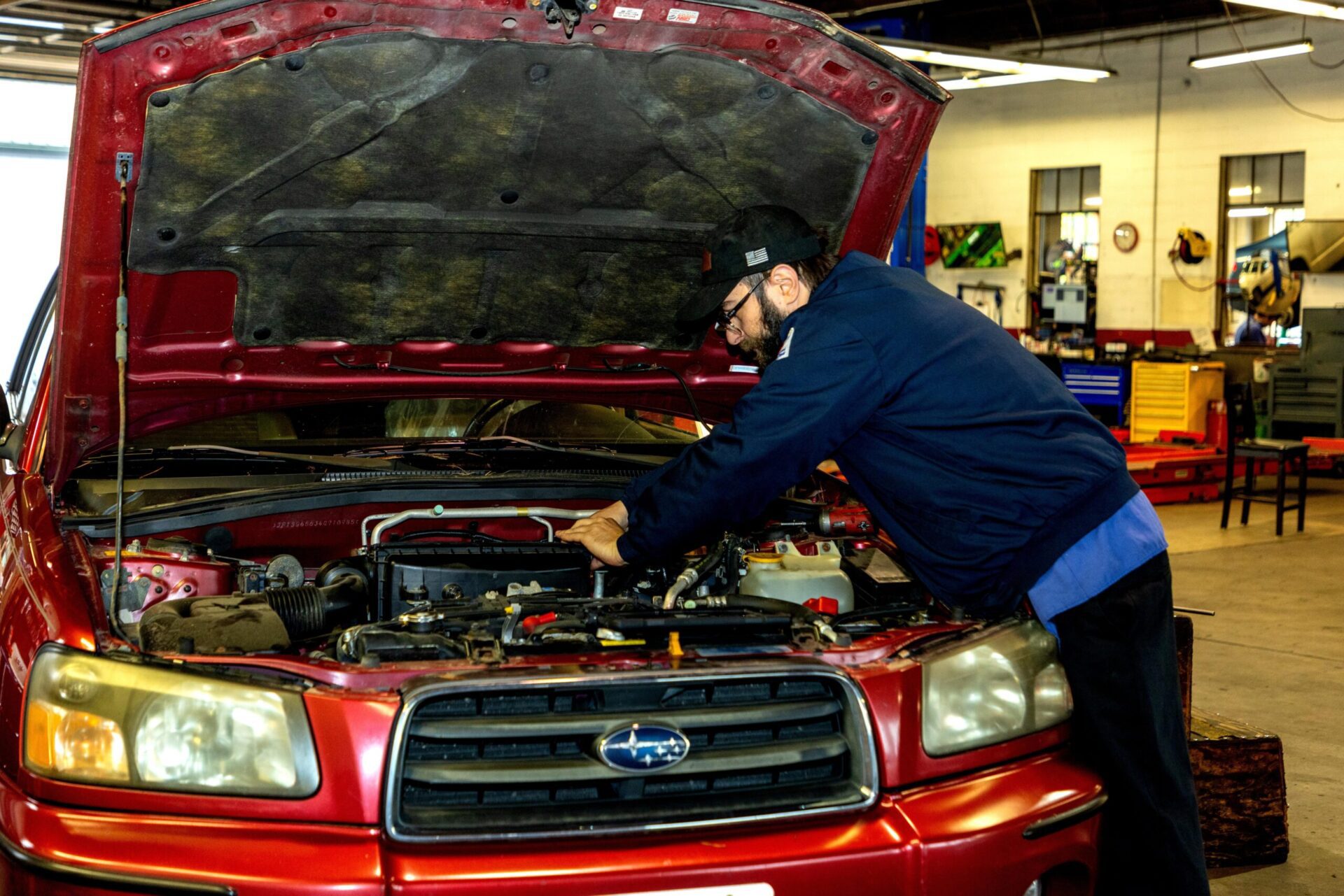 Mechanic Repairing Car Engine